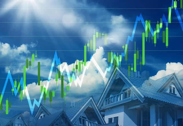 Upward trending stock market graph overlaid on residential houses, symbolizing real estate investment growth and property market success.
